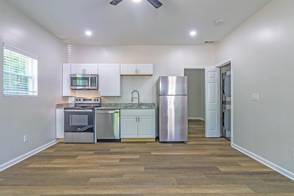 1912 Kitchens Road Macon, GA 31211 - Photo 5 of 20 a kitchen with a refrigerator and a stove top oven