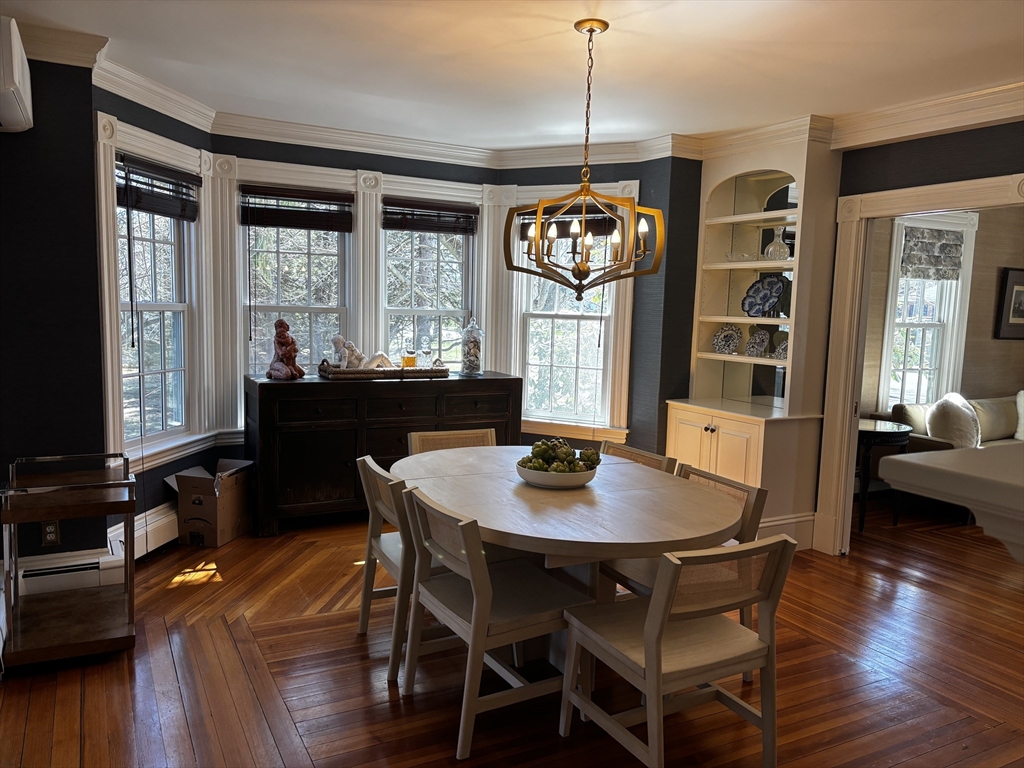 674 Webster Street Needham, MA 02492 - Photo 6 of 10 a view of a dining room with furniture window and wooden floor