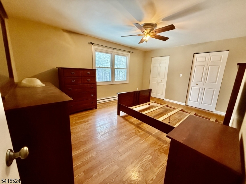 150 Karrville Road Port Murray, NJ 07865 - Photo 13 of 40 a living room with a table chairs and a chandelier