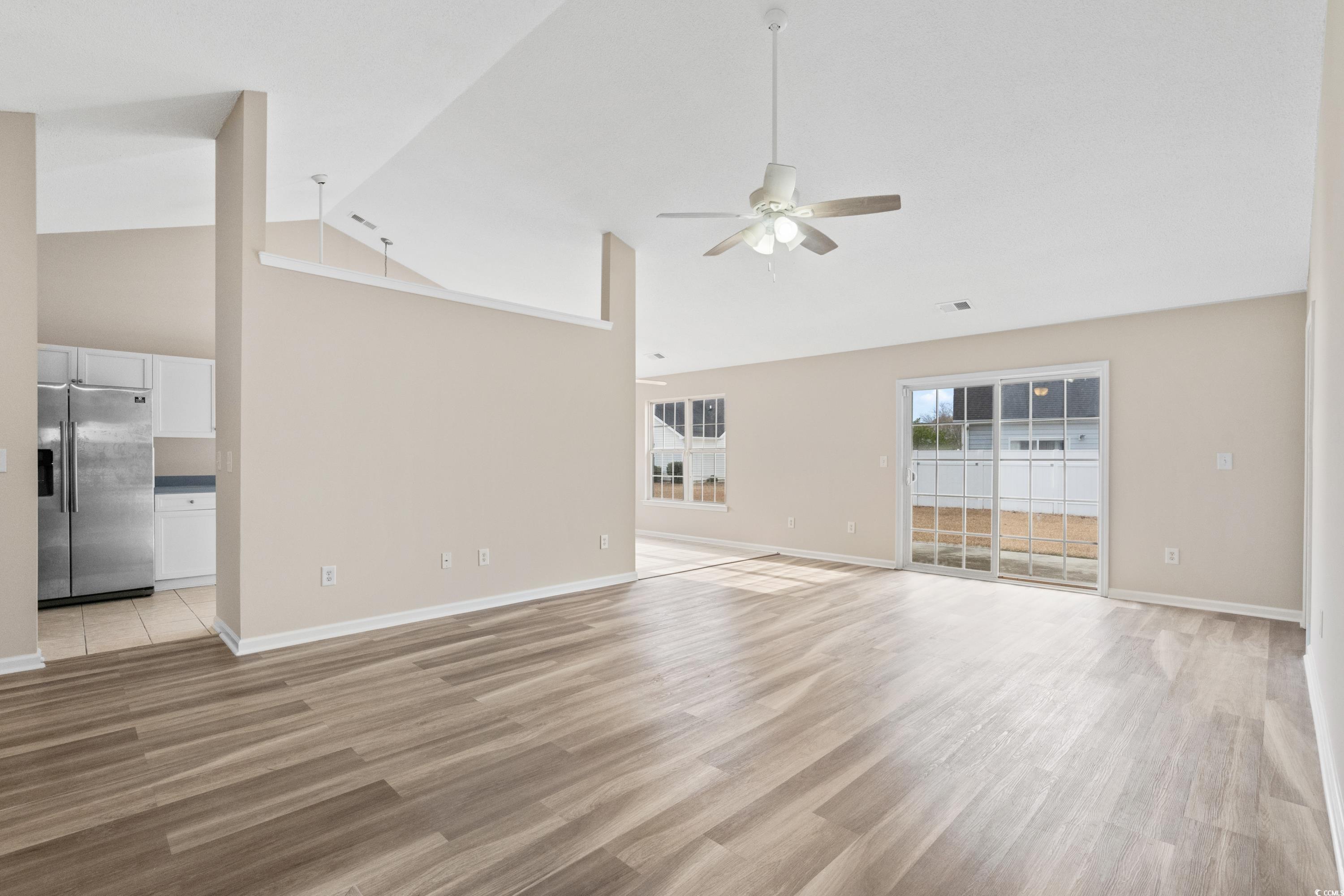 109 Governors Loop Myrtle Beach, SC 29588 - Photo 11 of 34 Unfurnished living room with ceiling fan, light ha