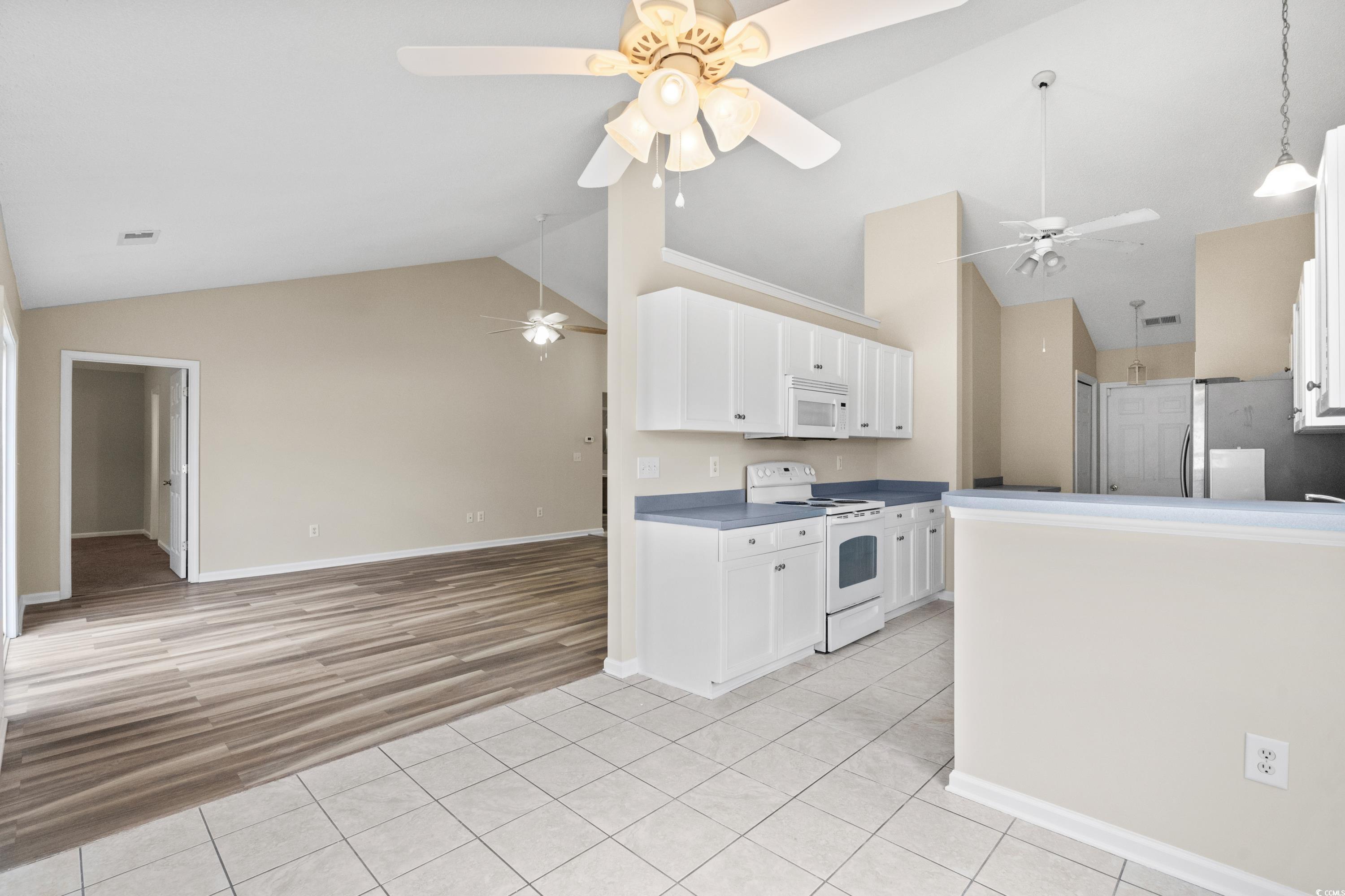 109 Governors Loop Myrtle Beach, SC 29588 - Photo 13 of 34 Unfurnished living room with light wood-type floor