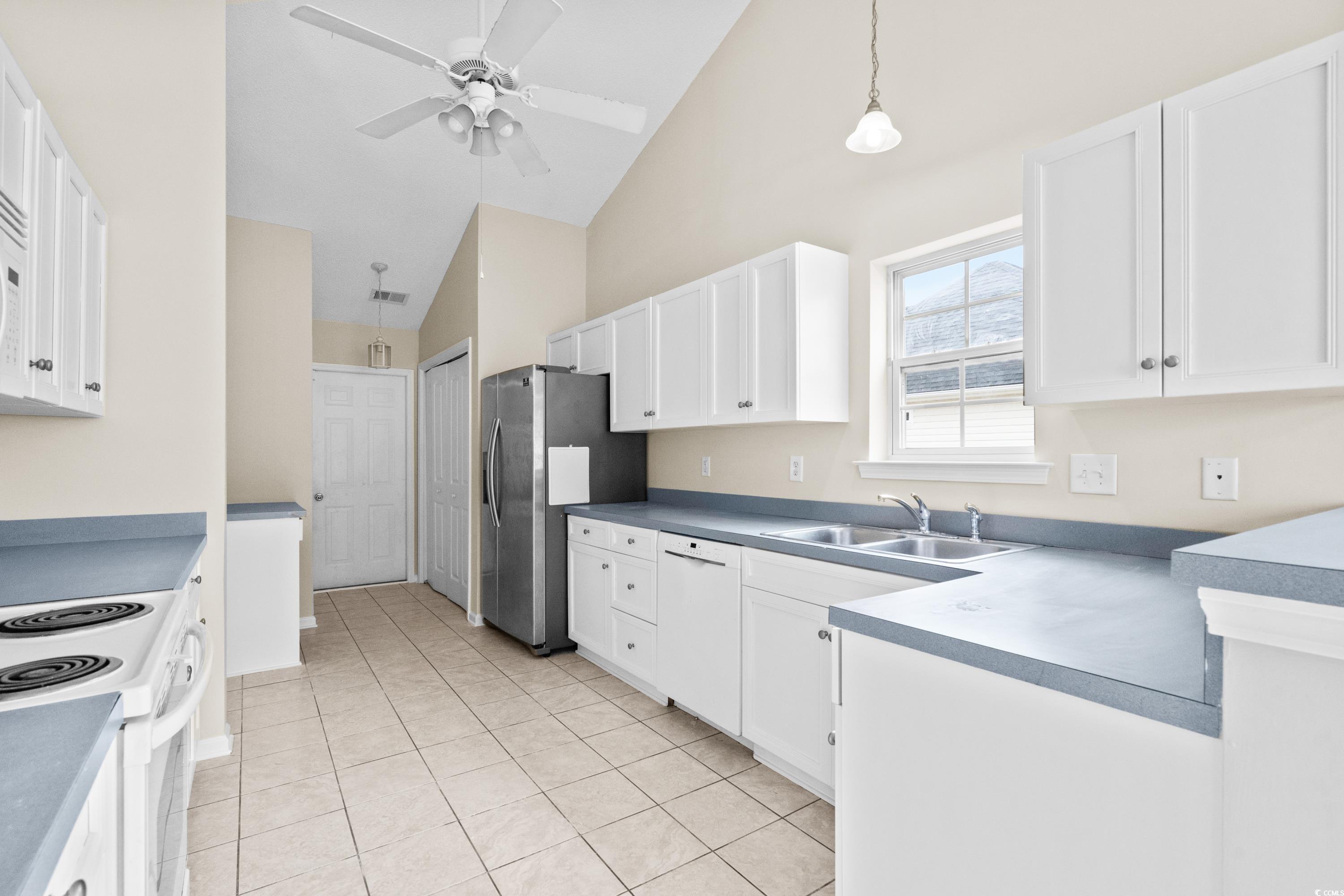 109 Governors Loop Myrtle Beach, SC 29588 - Photo 15 of 34 Unfurnished dining area with sink, vaulted ceiling