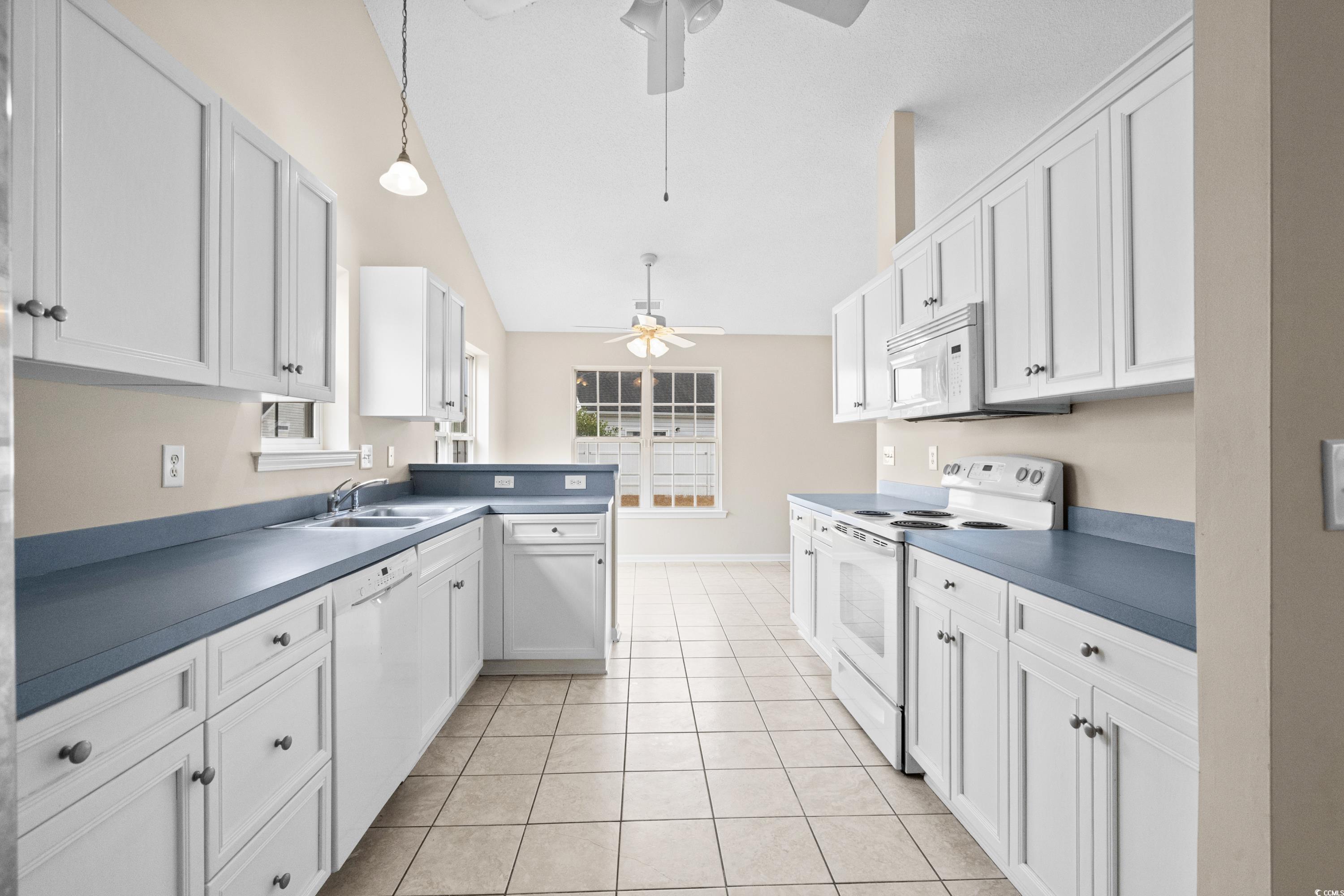 109 Governors Loop Myrtle Beach, SC 29588 - Photo 16 of 34 Kitchen featuring white cabinetry, light wood-type