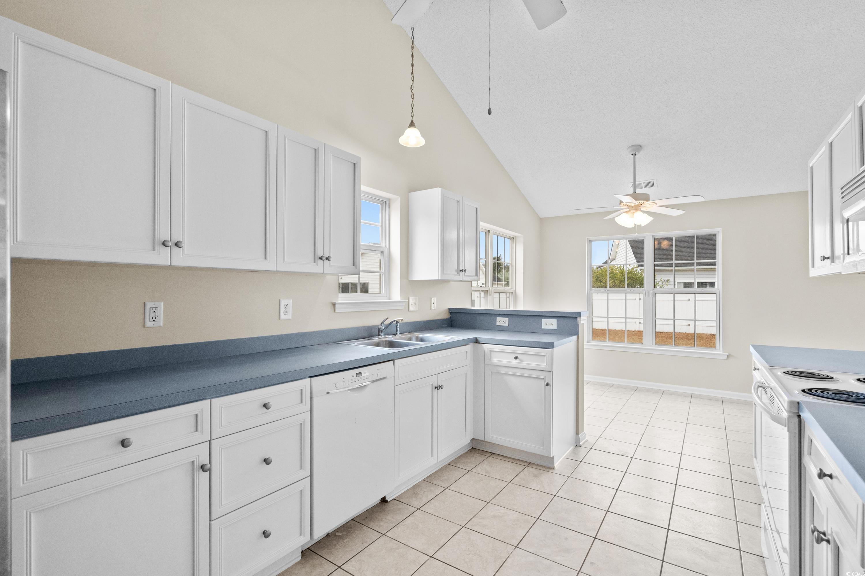 109 Governors Loop Myrtle Beach, SC 29588 - Photo 18 of 34 Kitchen with white cabinetry, sink, pendant lighti