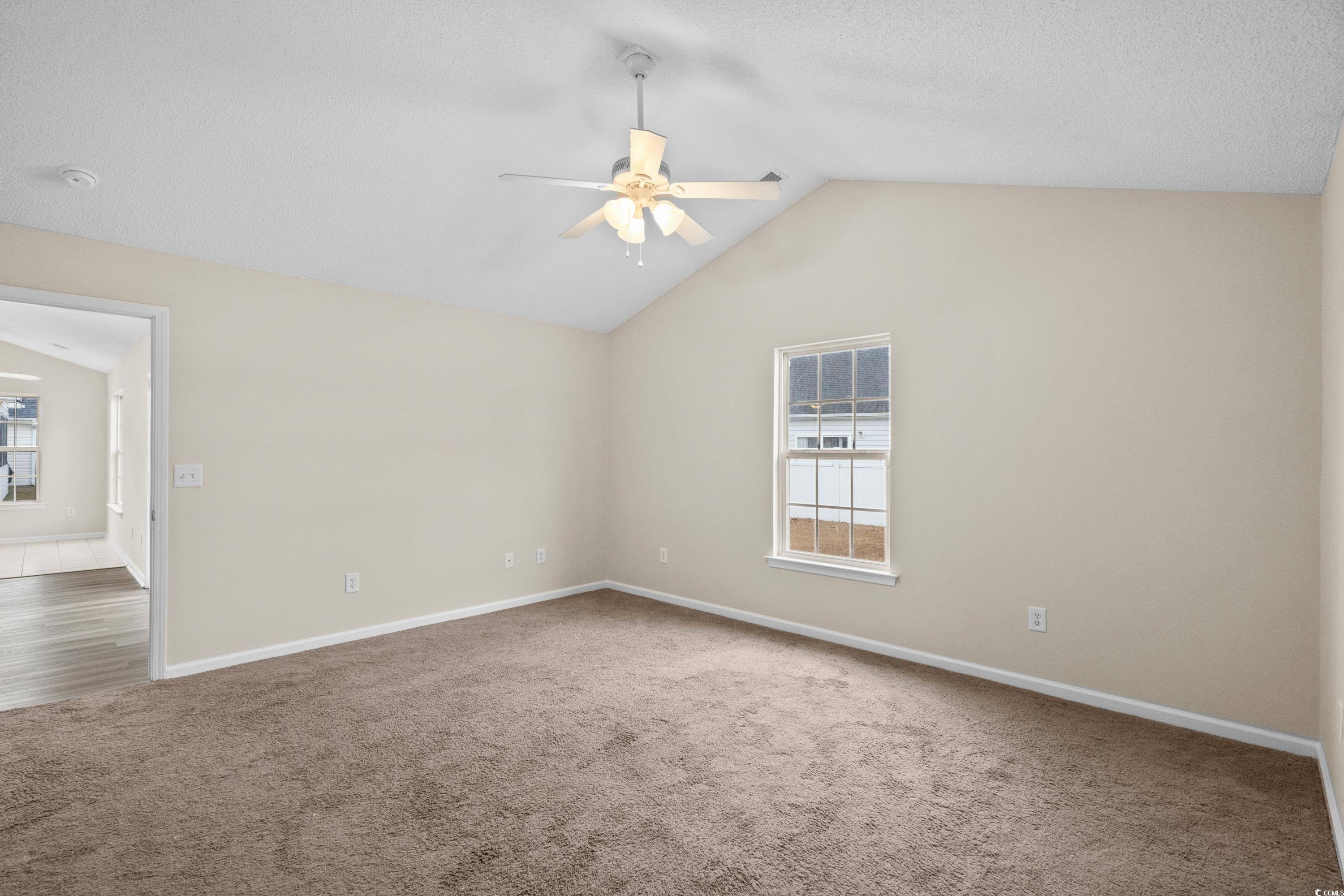 109 Governors Loop Myrtle Beach, SC 29588 - Photo 22 of 34 Kitchen with white cabinets, light tile patterned
