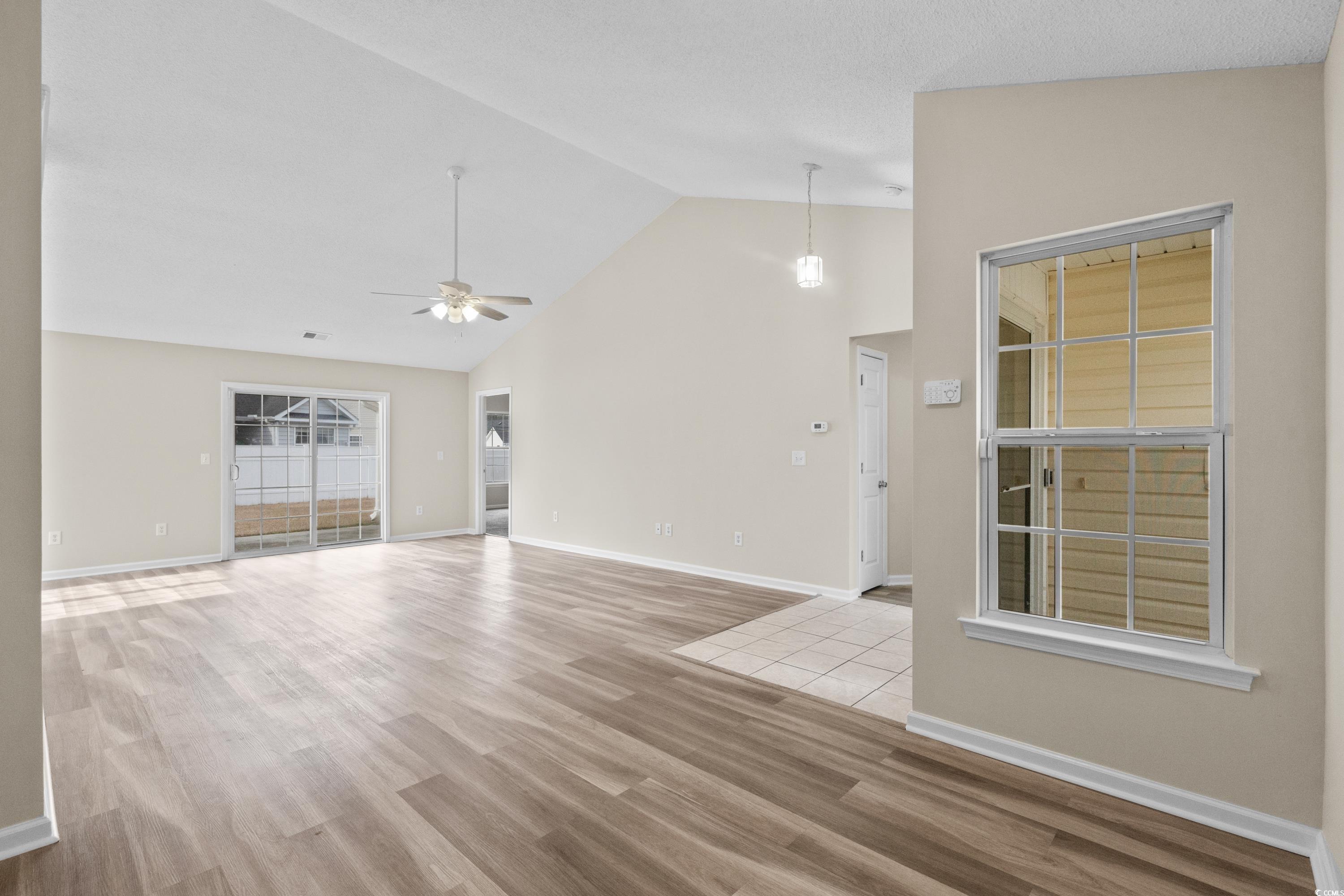 109 Governors Loop Myrtle Beach, SC 29588 - Photo 7 of 34 Unfurnished living room with ceiling fan, light ha