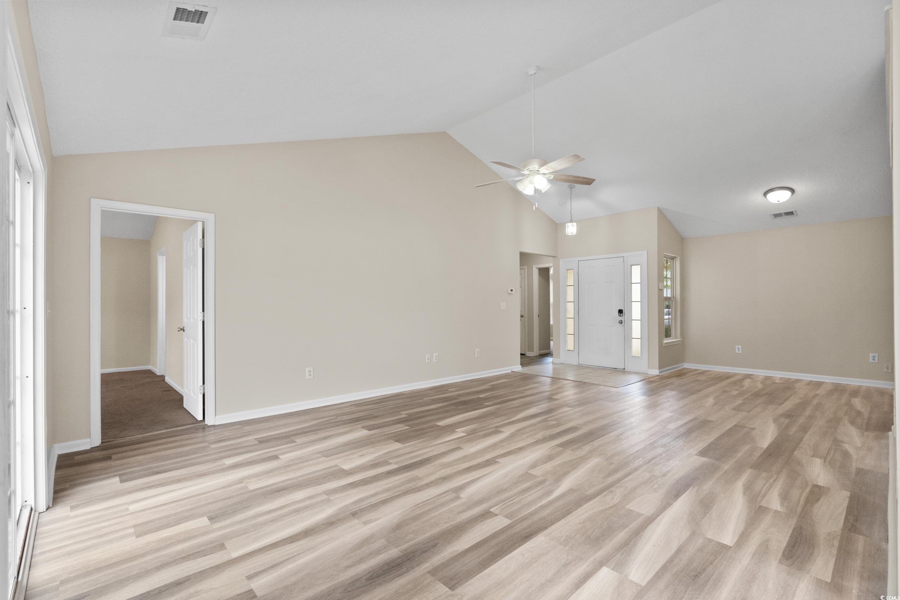 109 Governors Loop Myrtle Beach, SC 29588 - Photo 9 of 34 Spare room featuring vaulted ceiling, a textured c