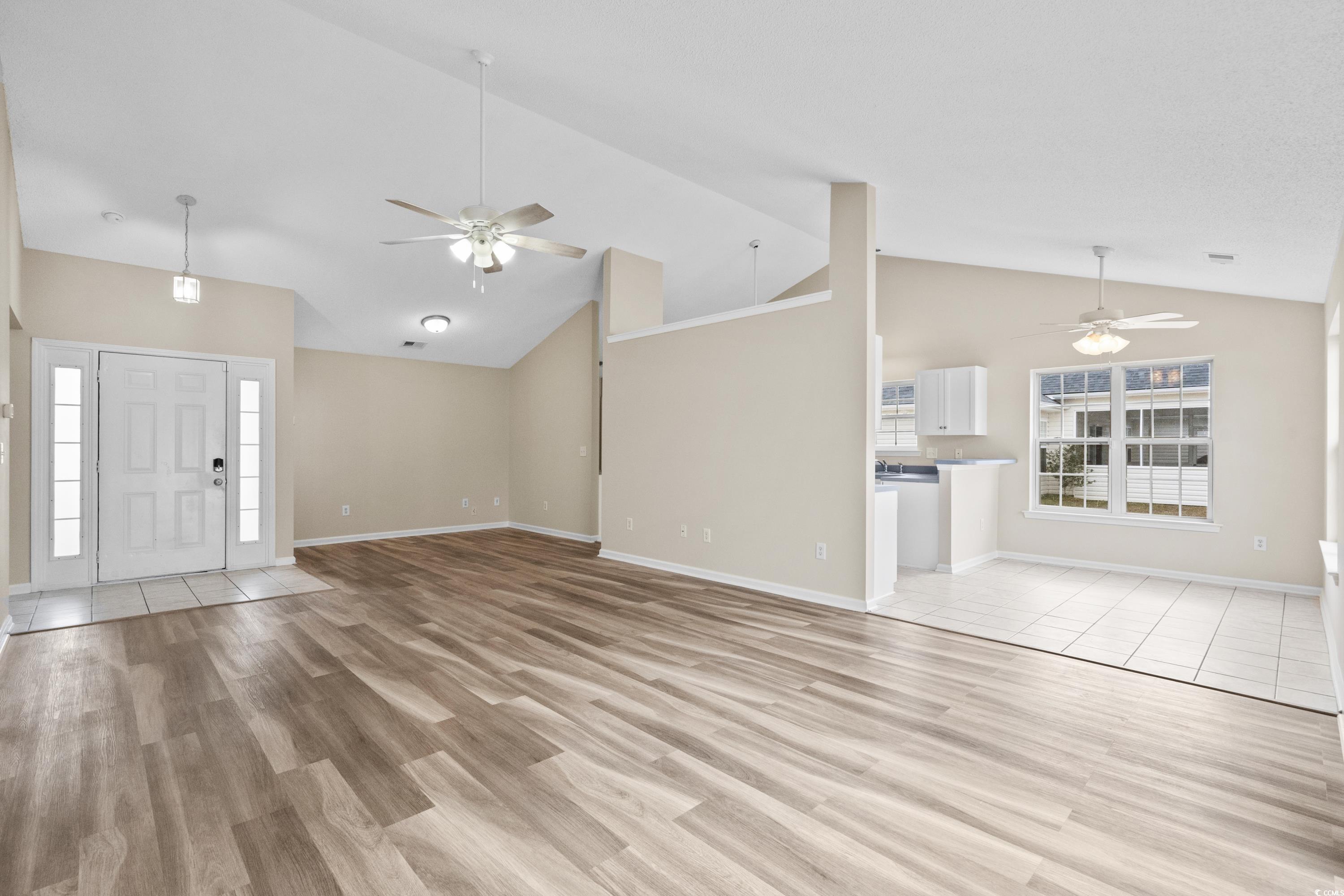 109 Governors Loop Myrtle Beach, SC 29588 - Photo 10 of 34 Unfurnished living room featuring ceiling fan, lig