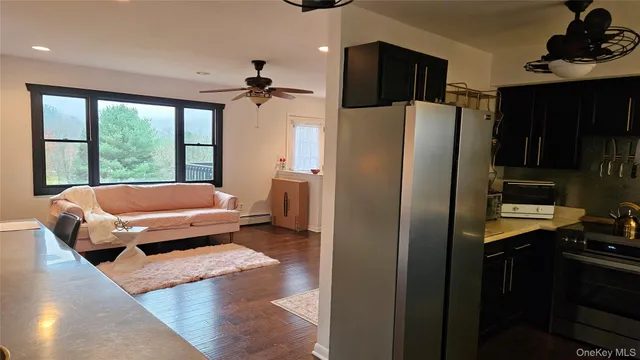 a living room with furniture fireplace and flat screen tv