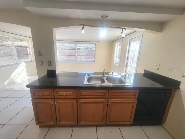 a kitchen with a sink and cabinets