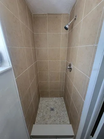 a bathroom with a sink and shower