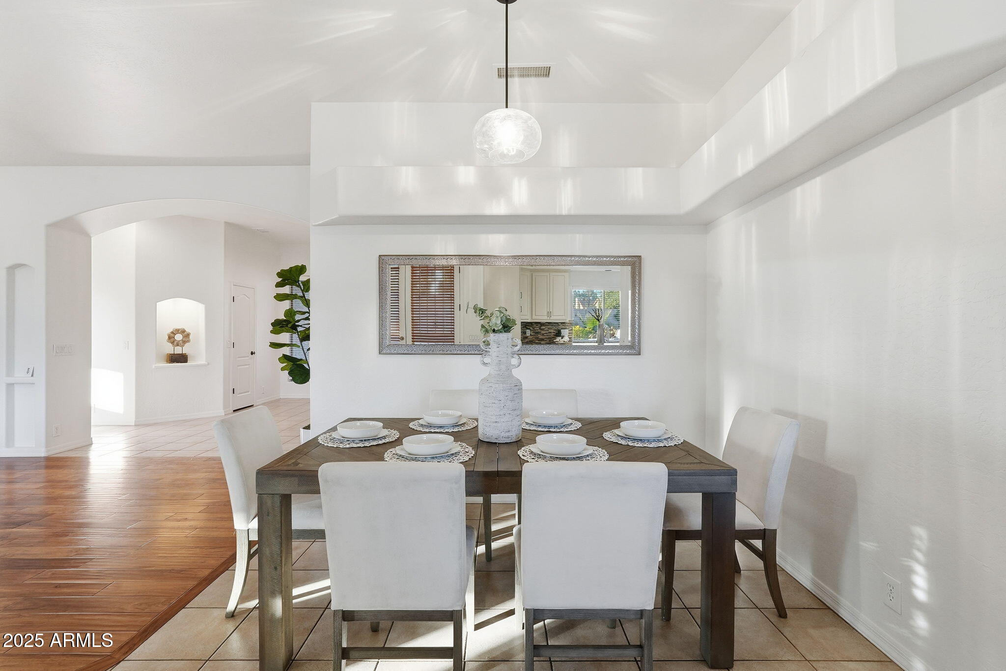 4409 East Janice Way Phoenix, AZ 85032 - Photo 12 of 41 a view of a dining room with furniture and wooden floor