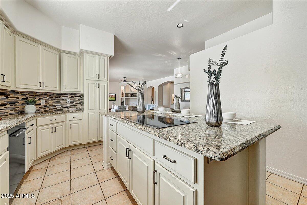 4409 East Janice Way Phoenix, AZ 85032 - Photo 16 of 41 a kitchen with sink cabinets and stove