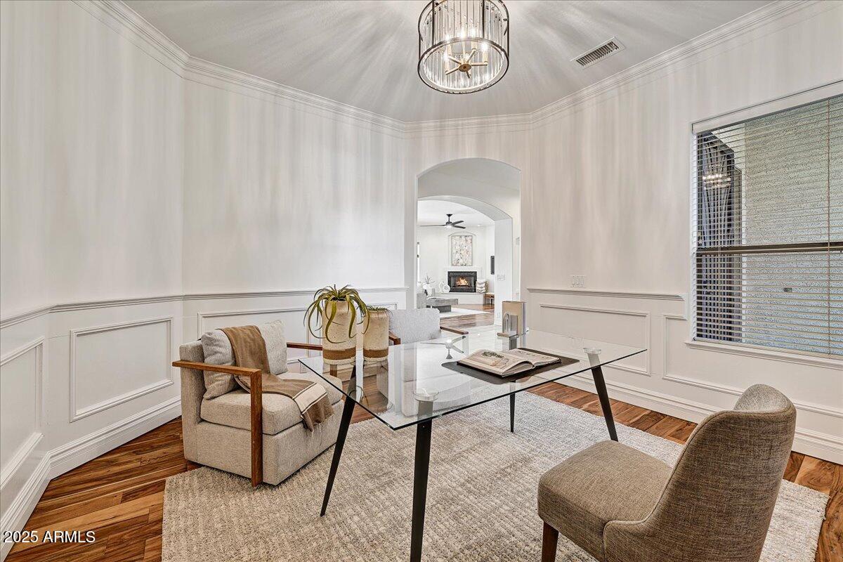 4409 East Janice Way Phoenix, AZ 85032 - Photo 18 of 41 a living room with furniture a chandelier and a window