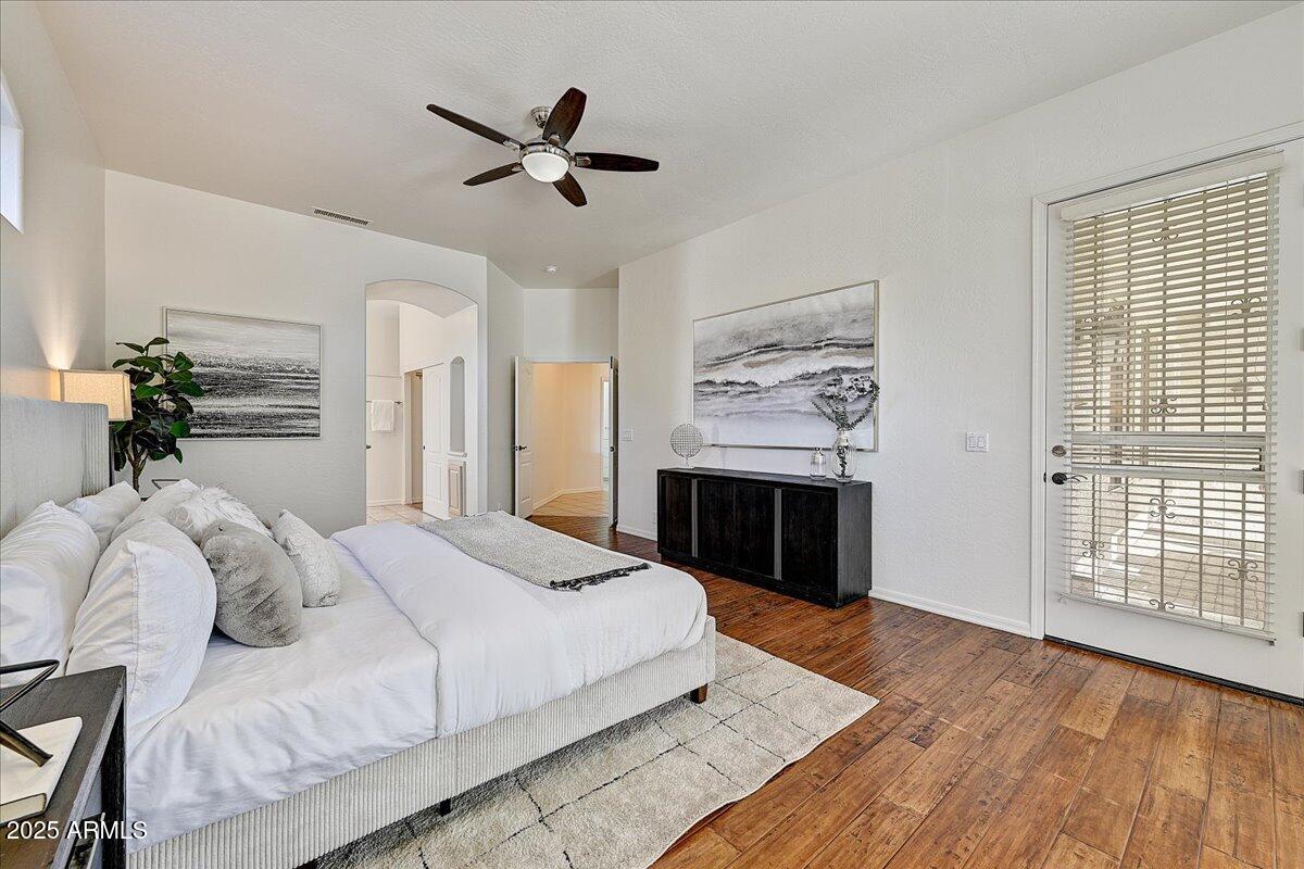 4409 East Janice Way Phoenix, AZ 85032 - Photo 23 of 41 a bed room with a bed and a ceiling fan