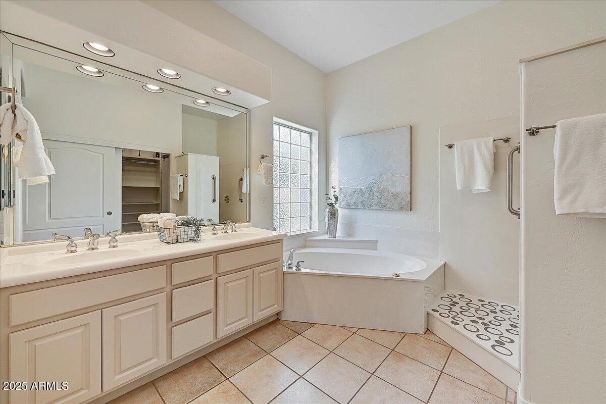4409 East Janice Way Phoenix, AZ 85032 - Photo 24 of 41 a bathroom with a double vanity sink mirror and bathtub