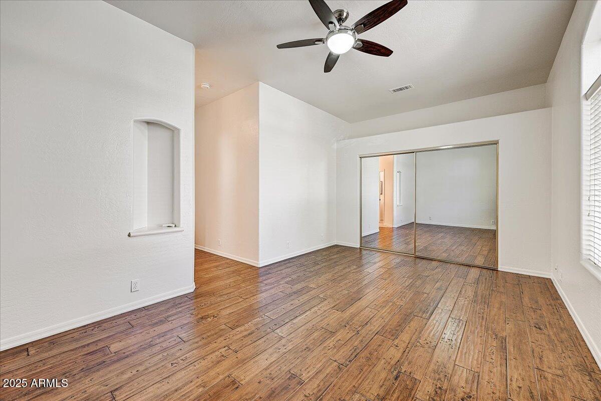 4409 East Janice Way Phoenix, AZ 85032 - Photo 28 of 41 a view of an empty room and wooden floor