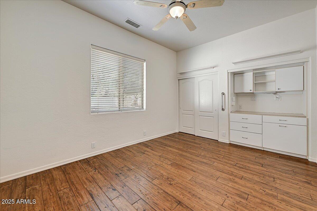 4409 East Janice Way Phoenix, AZ 85032 - Photo 31 of 41 wooden floor in an empty room with a window