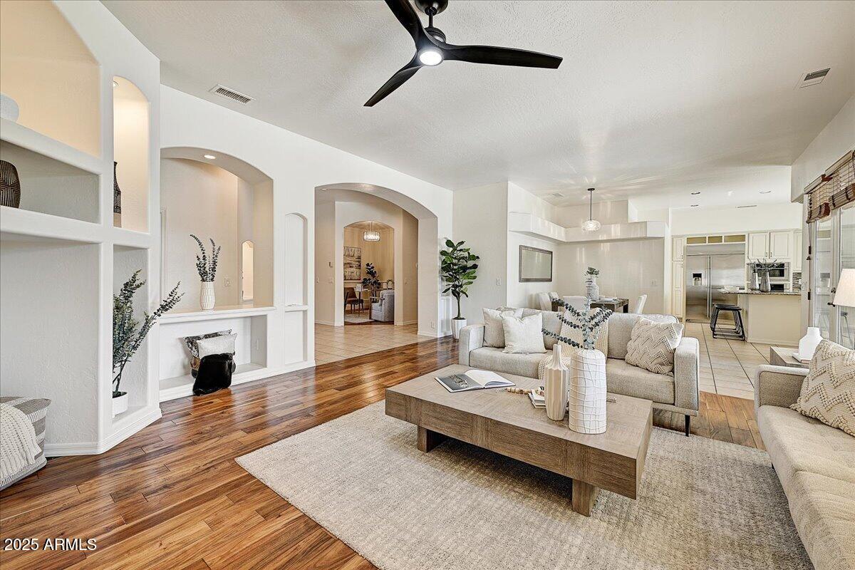 4409 East Janice Way Phoenix, AZ 85032 - Photo 8 of 41 a living room with furniture and a fireplace