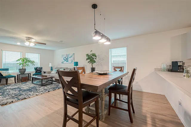 a kitchen with stainless steel appliances a refrigerator sink and microwave