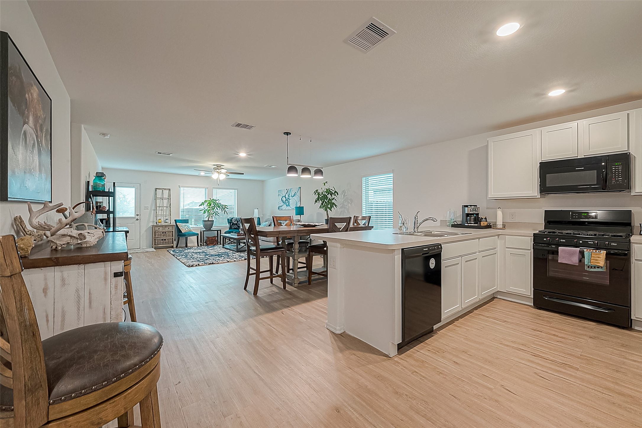 724 Cedar Gate Lane La Marque, TX 77568 - Photo 20 of 40 a kitchen with a sink cabinets and wooden floor