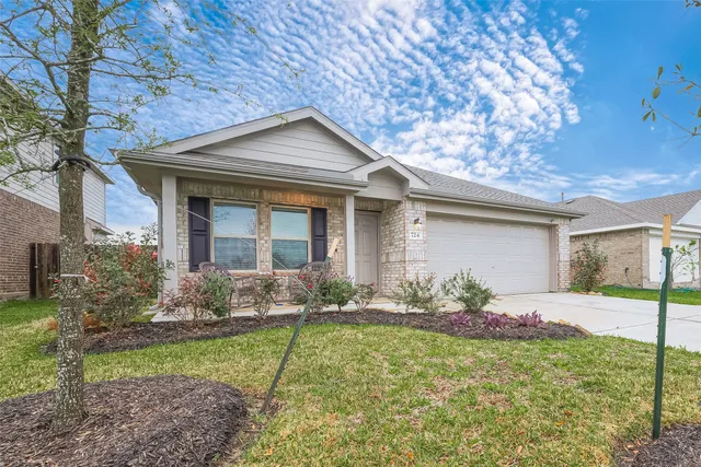 a front view of house with yard and outdoor seating