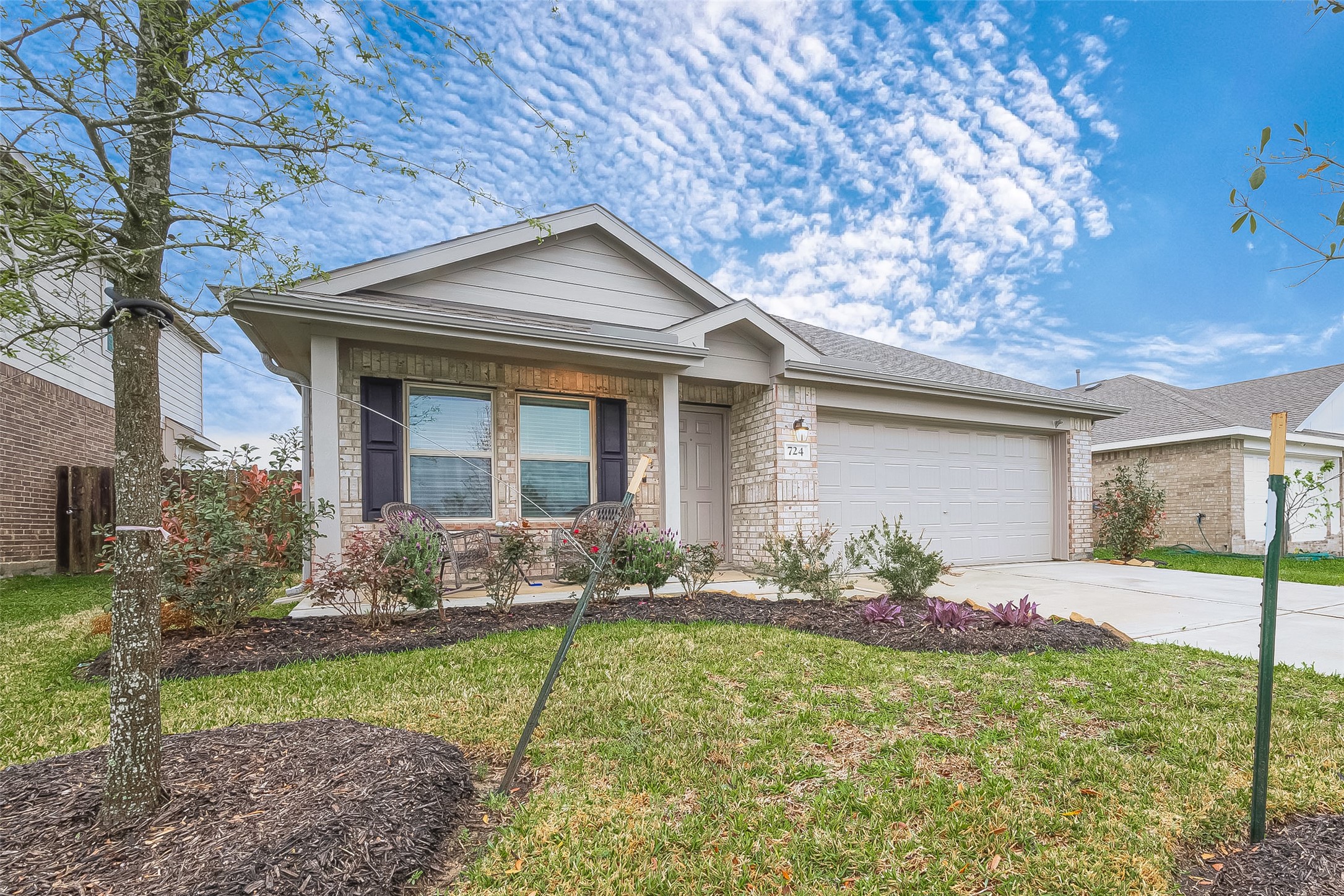 724 Cedar Gate Lane La Marque, TX 77568 - Photo 2 of 40 a front view of house with yard and outdoor seating