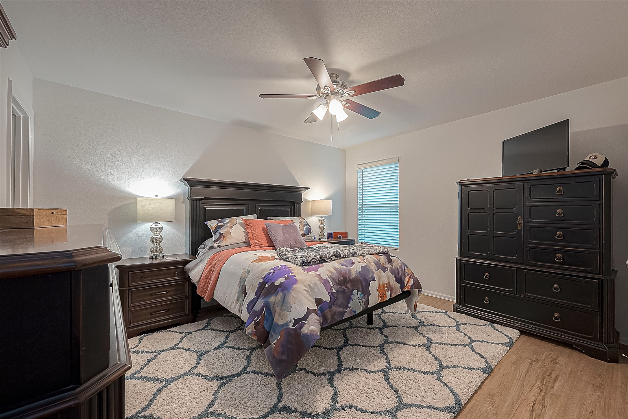 724 Cedar Gate Lane La Marque, TX 77568 - Photo 24 of 40 a bedroom with a bed and a chandelier