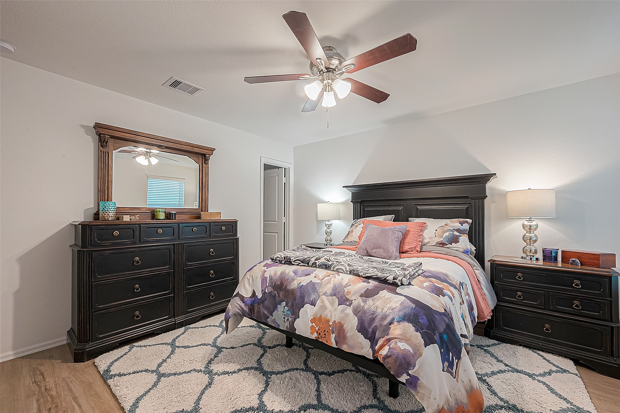 724 Cedar Gate Lane La Marque, TX 77568 - Photo 25 of 40 a bedroom with a bed and a mirror on dresser