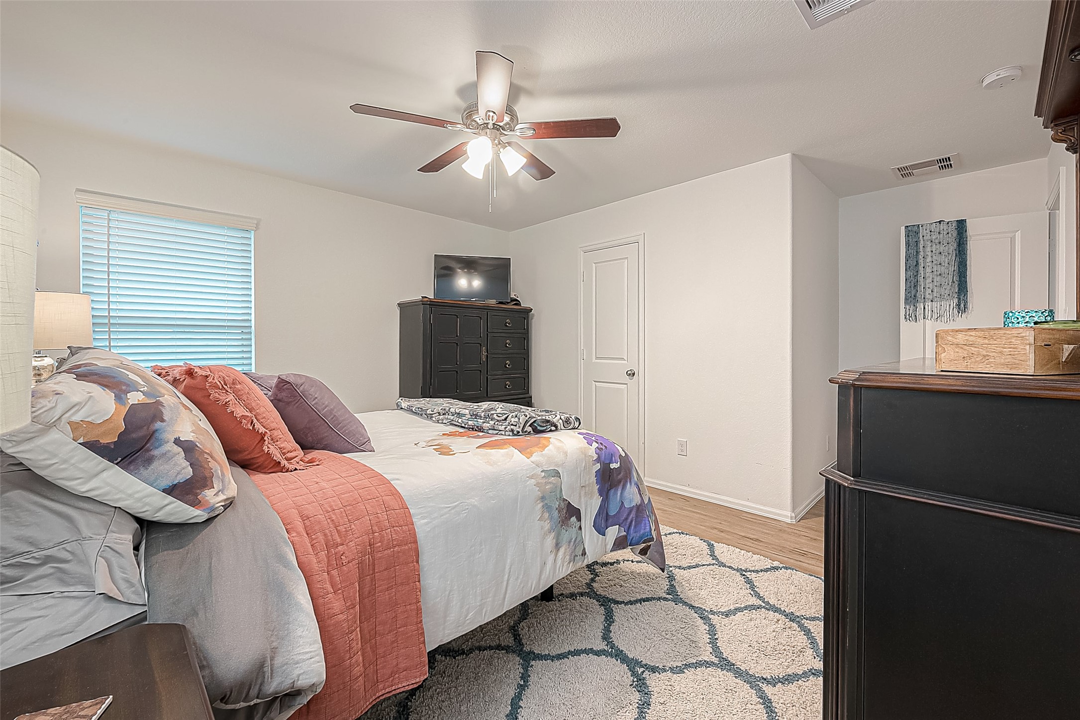 724 Cedar Gate Lane La Marque, TX 77568 - Photo 26 of 40 a bedroom with a bed and a chandelier