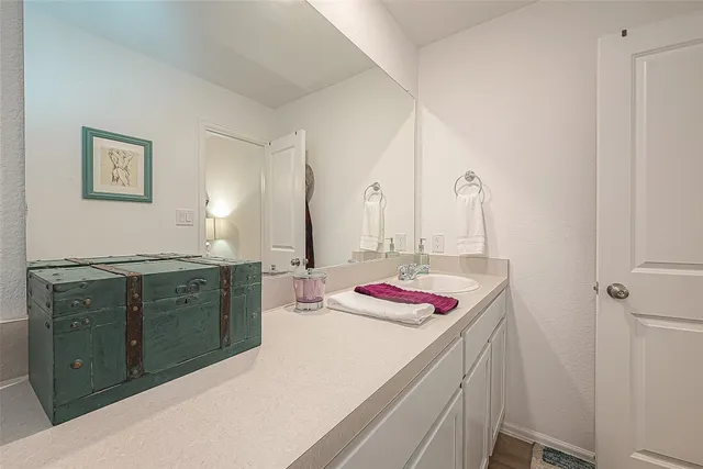 a room that has a mirror and a sink