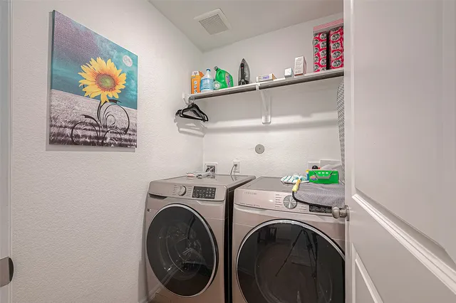 a view of a backyard with couches with wooden fence
