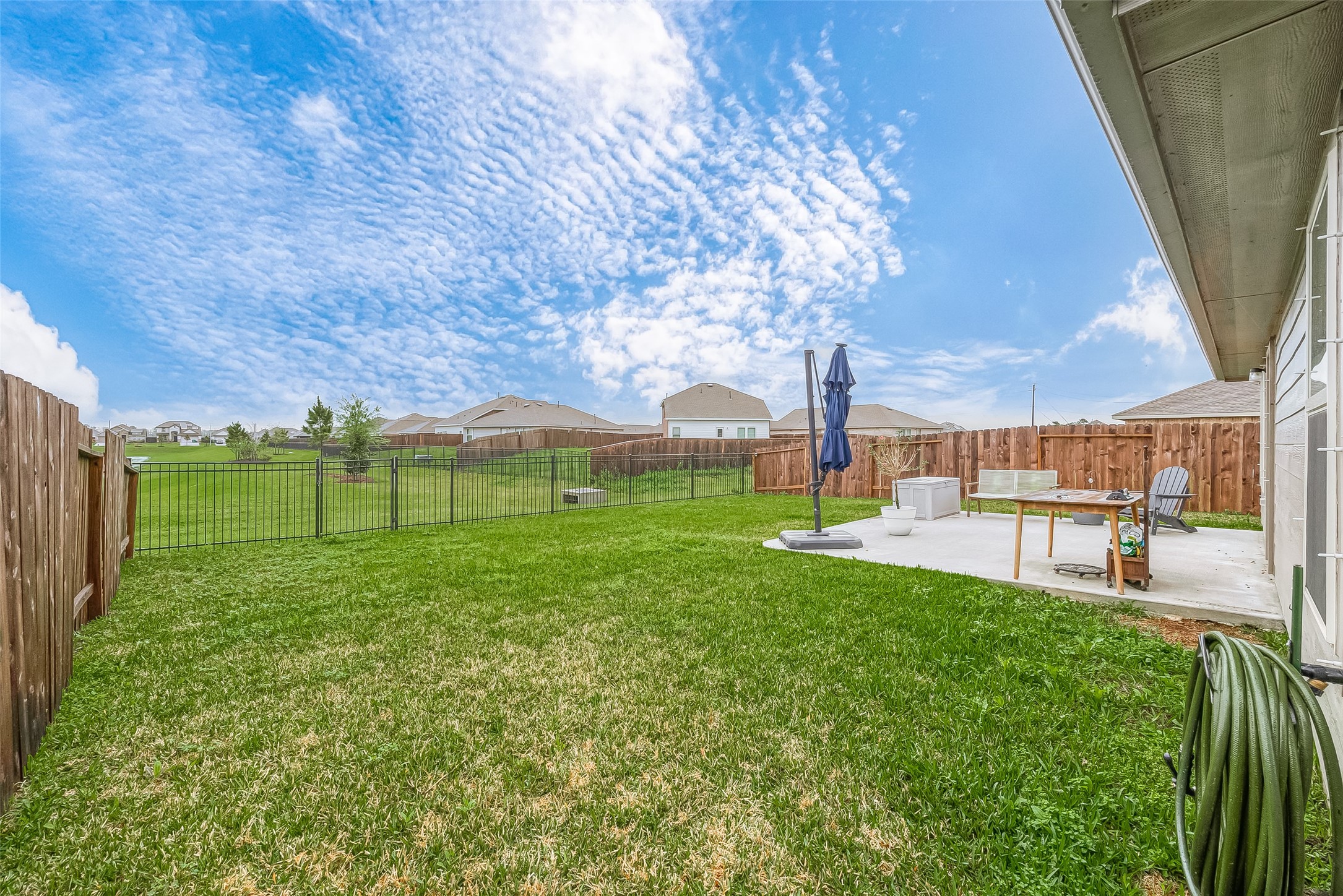 724 Cedar Gate Lane La Marque, TX 77568 - Photo 34 of 40 a view of a backyard with couches with wooden fence