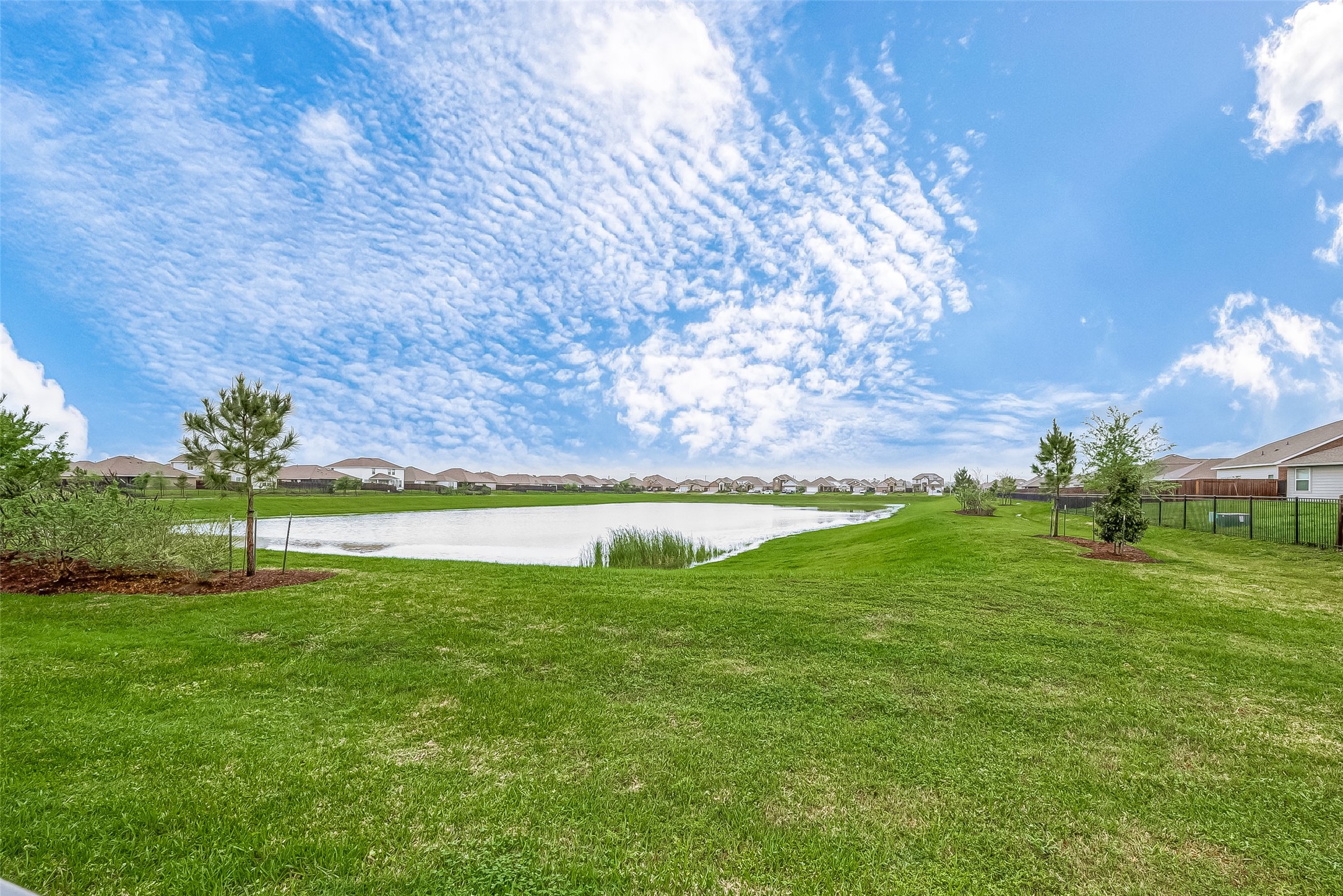 724 Cedar Gate Lane La Marque, TX 77568 - Photo 36 of 40 a view of a golf course with a lake