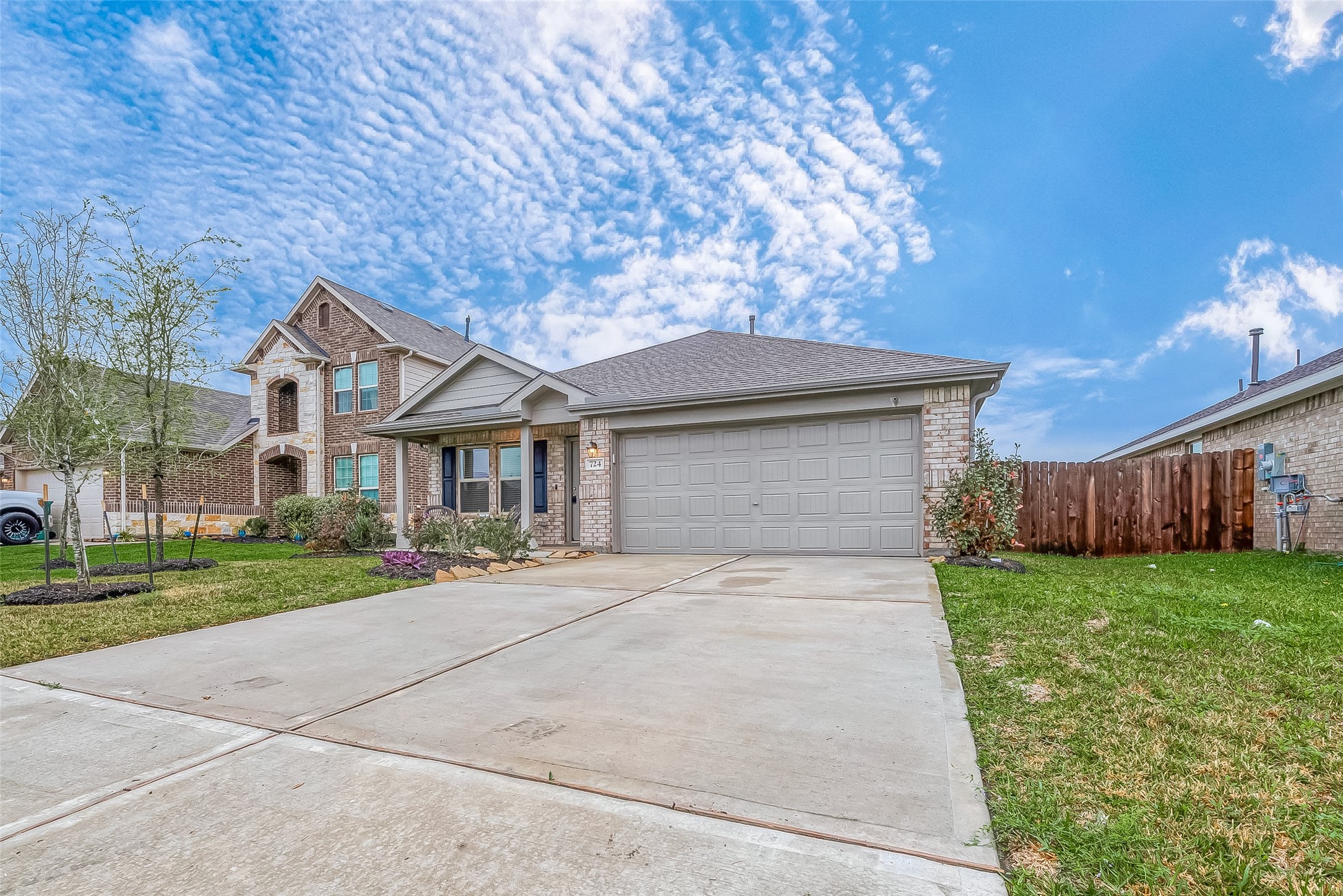 724 Cedar Gate Lane La Marque, TX 77568 - Photo 5 of 40 a front view of a house with a yard and garage
