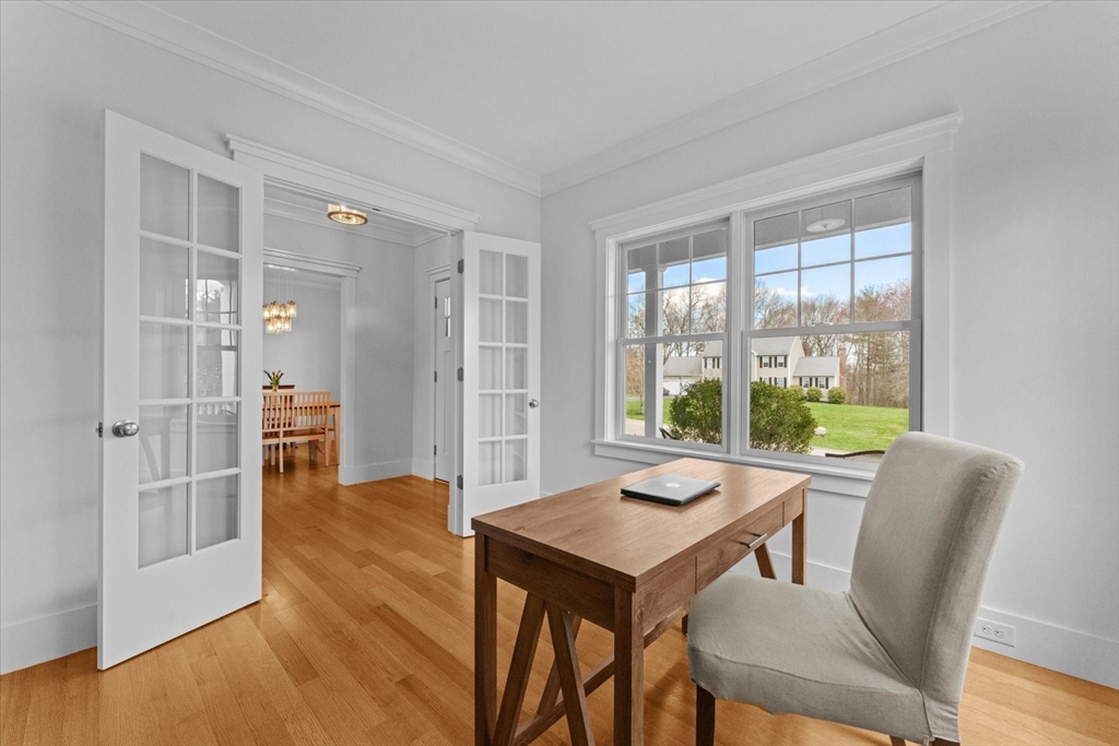 50 Quabbin Path Sutton, MA 01590 - Photo 11 of 42 a view of a dining room with furniture window and wooden floor