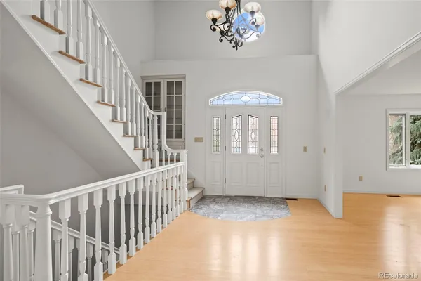 a view of an entryway with wooden floor