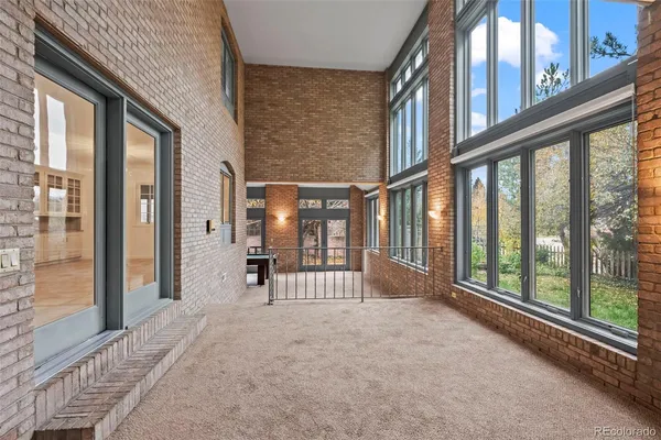 a view of an entryway with a floor to ceiling window