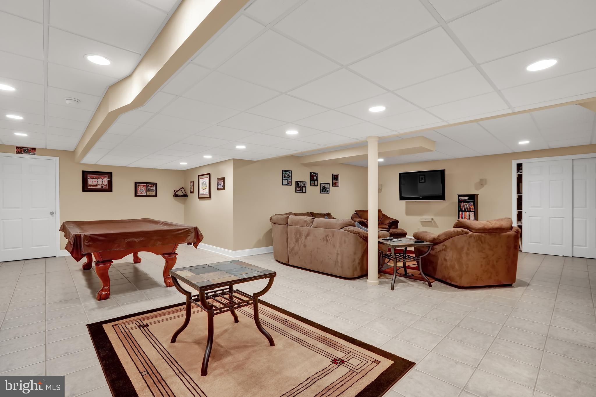 305 West Sandy Ridge Road Doylestown, PA 18901 - Photo 32 of 32 Finished basement with ceramic tile flooring