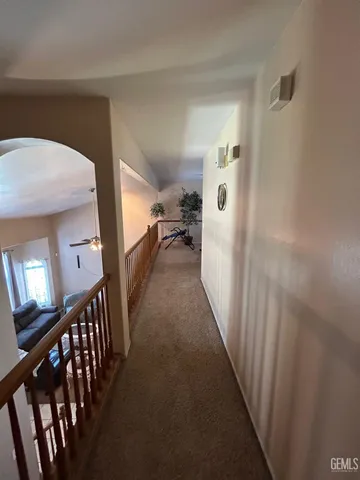 a view of a hallway view with staircase