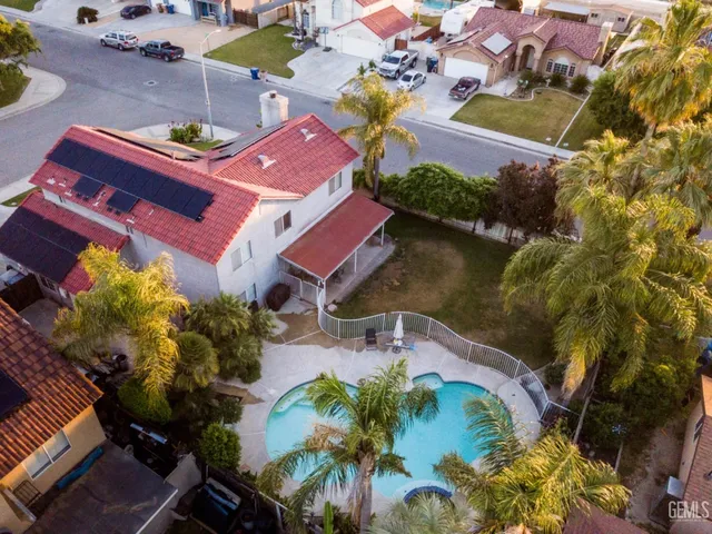 an aerial view of a house with a garden