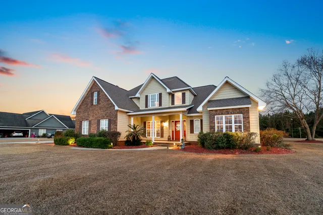 swimming pool view with a seating space and a garden view