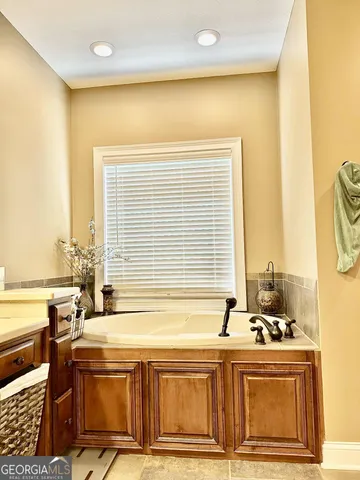 a view of a kitchen with a sink and cabinets
