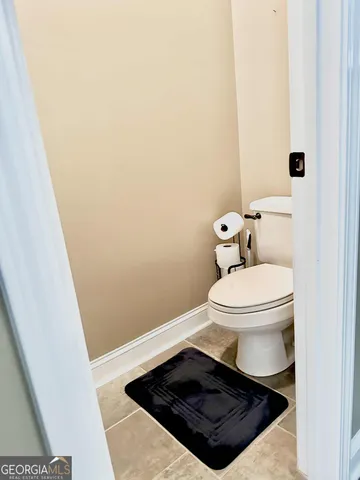 a bathroom with a toilet and a sink