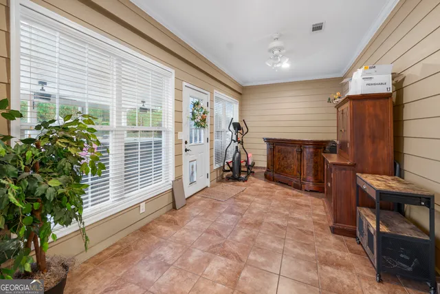 a bedroom with bed and window
