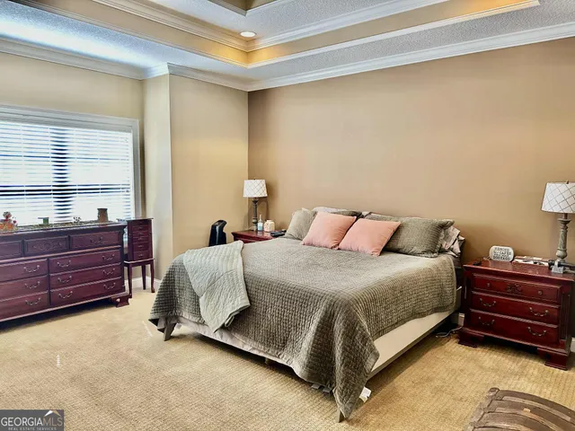 a view of a dining room with furniture wooden floor and chandelier