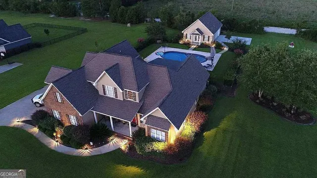 an aerial view of houses with yard