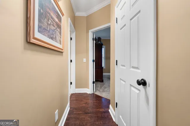 a bedroom with bed and a chandelier