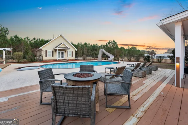 an aerial view of a house with a backyard