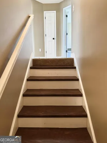 a view of a chairs and table in a patio